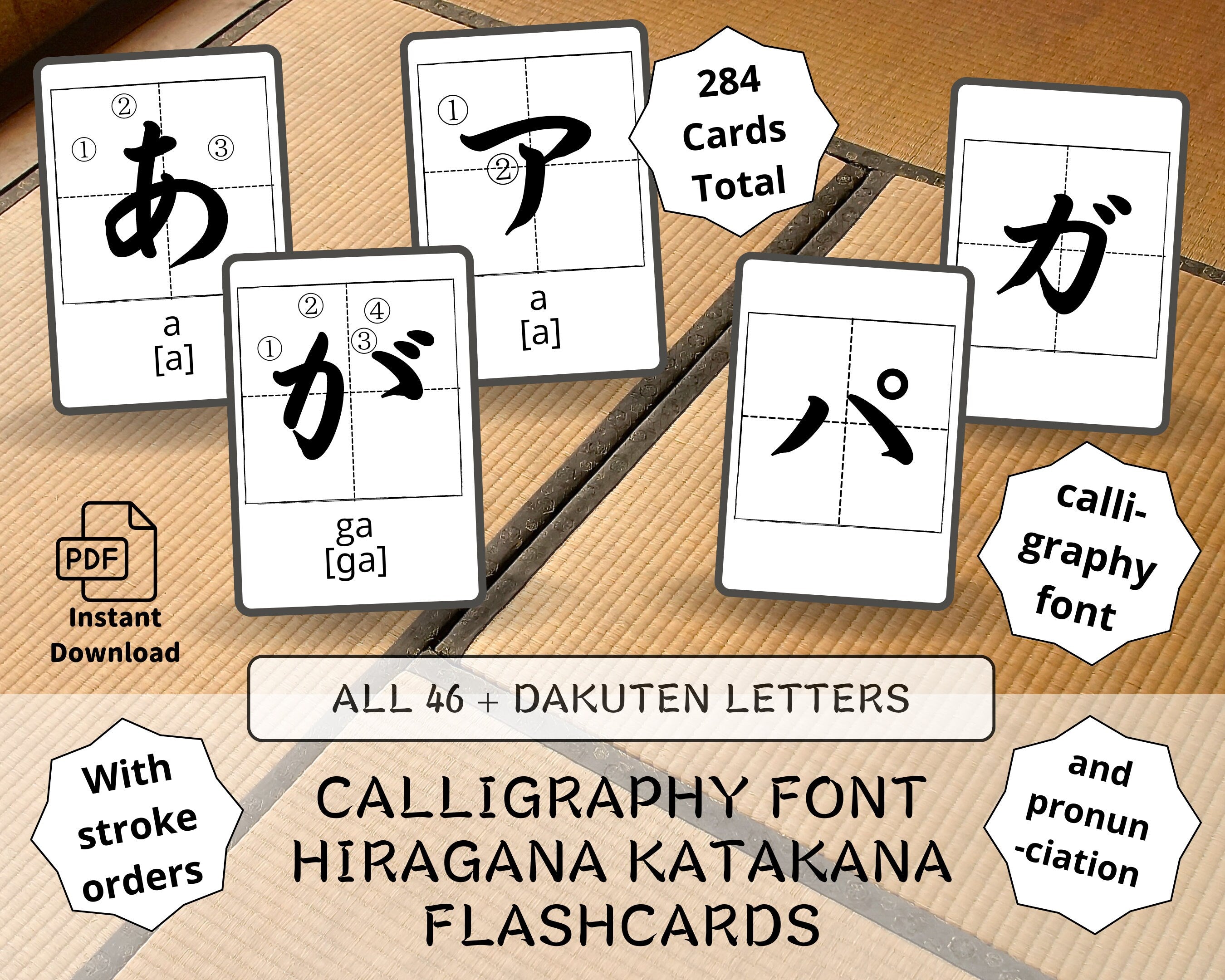 Set of Japanese calligraphy flashcards with characters and stroke orders on a wooden surface.