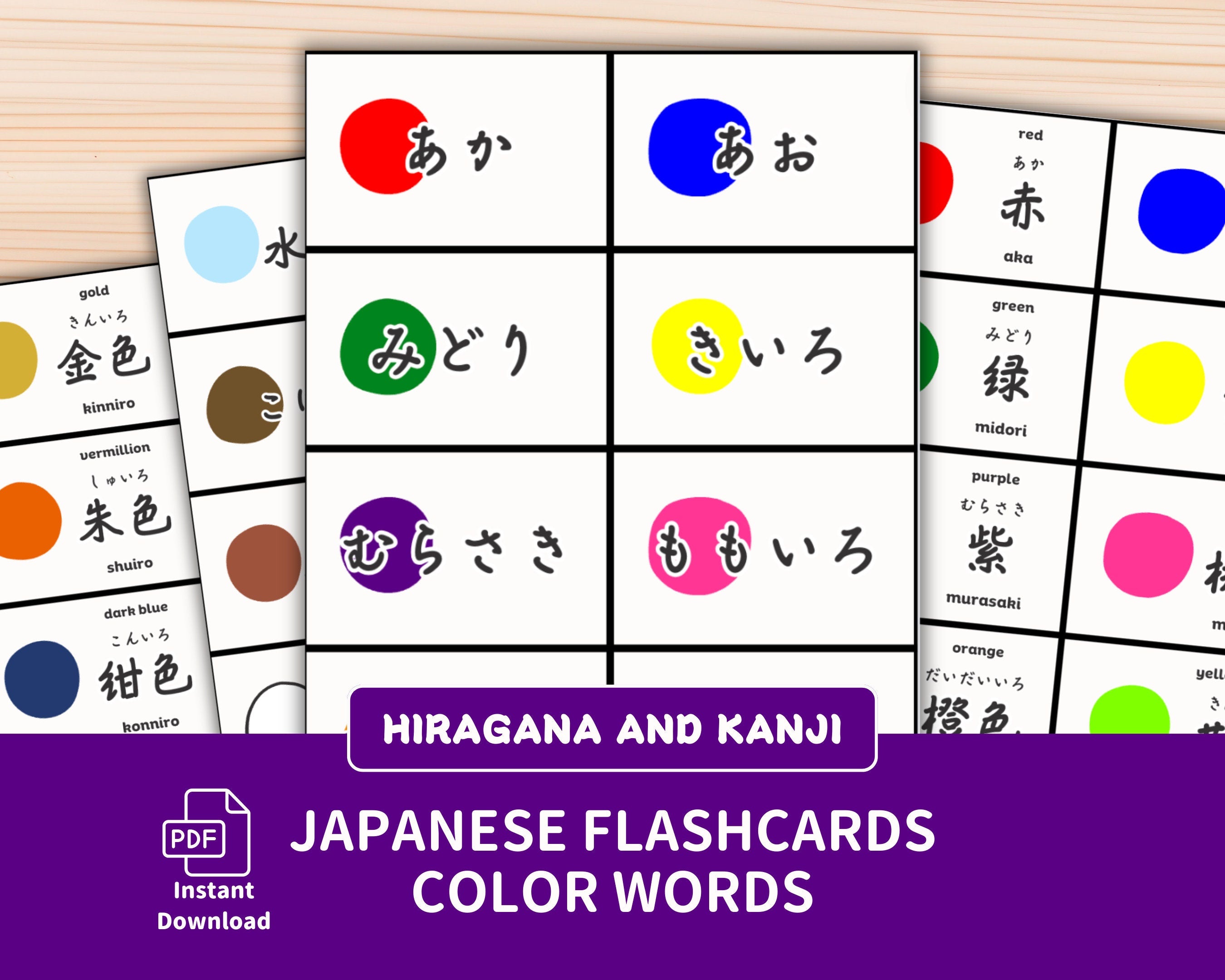 Japanese flashcards for hiragana and kanji with color words on a wooden surface.
